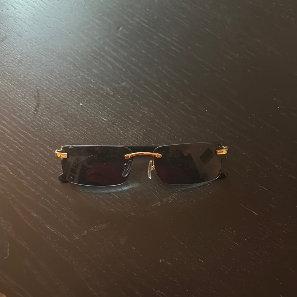 Stylish Black and Gold Rimless Sunglasses